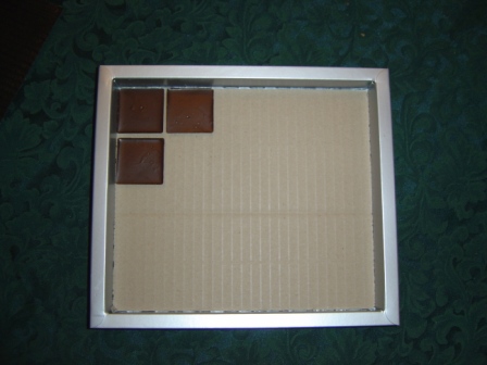 Box containing three chocolates
